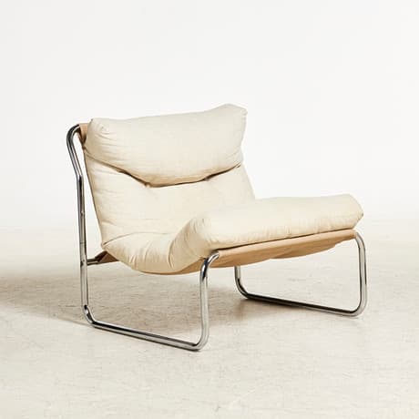 GILLIS LUNDGREN. Armchair, 'Revolt'', IKEA, 1970s, frame in chromed steel tube, upholstered back and seat covered in deep-stitched canvas.
