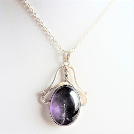 ARTISAN SILVER CABOCHON AMETHYST PENDANT.